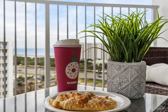 a view of a balcony with wooden floor