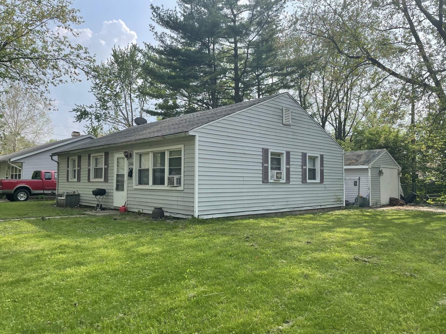 1909 Joanne Lane Champaign, IL 61821 - Photo 3 of 4 a view of a house with a yard