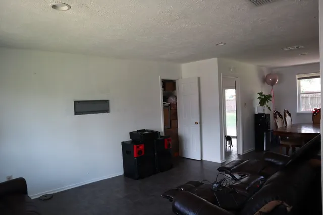 a room with furniture and gym equipment