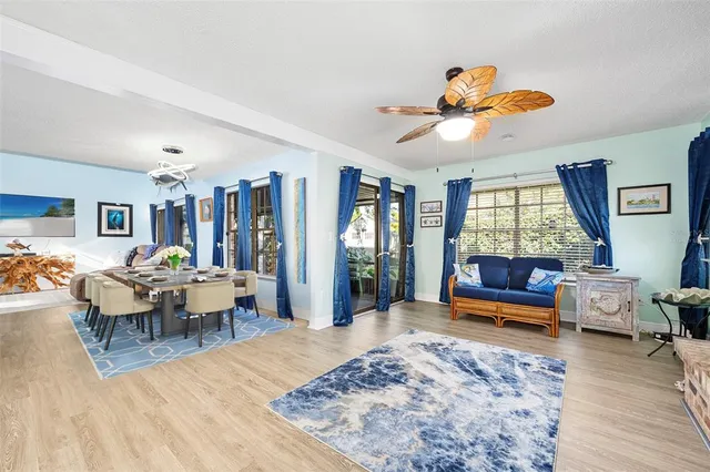 a living room with furniture window and wooden floor