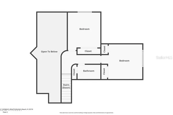 a living room with furniture and a gate