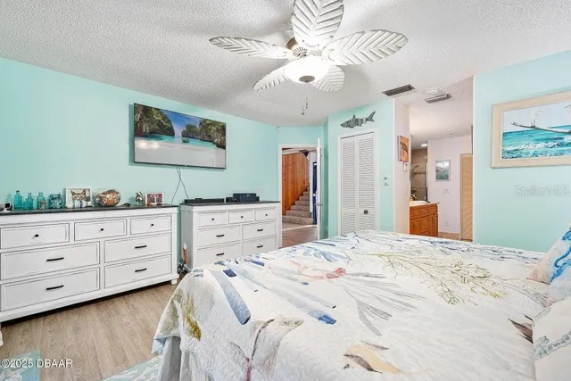 a bedroom with a bed and a dresser