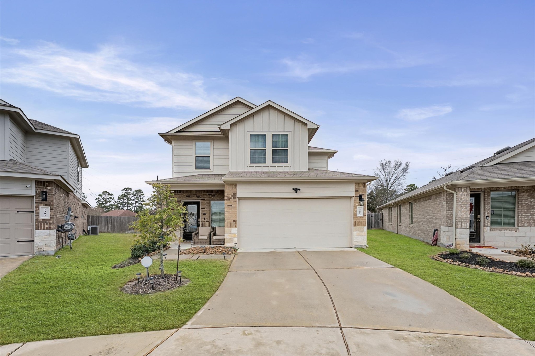 a front view of house with yard and green space