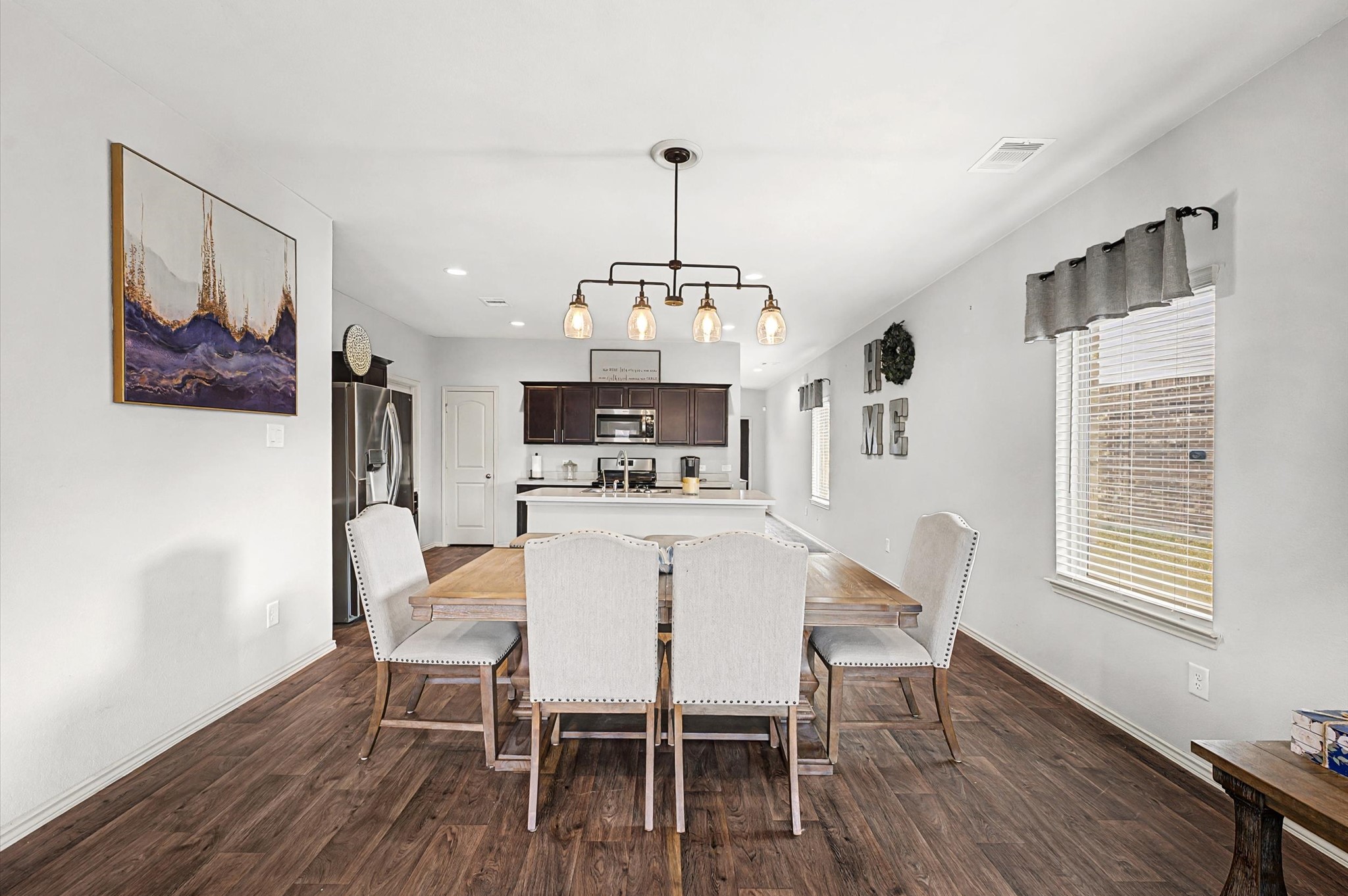 22803 Berthoud Trail Spring, TX 77373 - Photo 11 of 42 a view of a dining room with furniture window and wooden floor