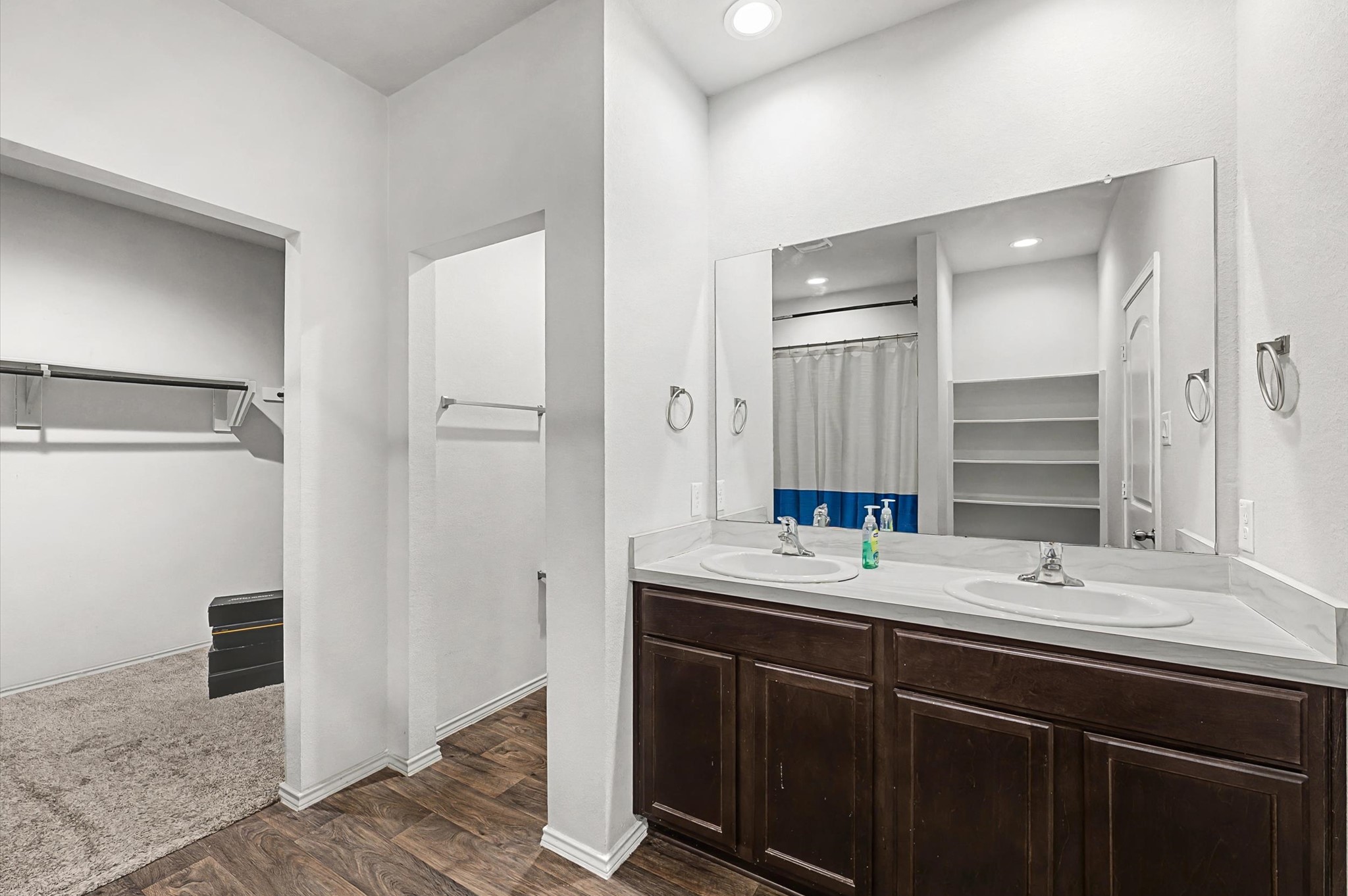 22803 Berthoud Trail Spring, TX 77373 - Photo 18 of 42 a bathroom with a double vanity sink a mirror and a shower