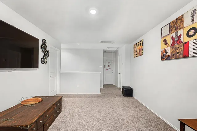 a view of room with flat screen tv