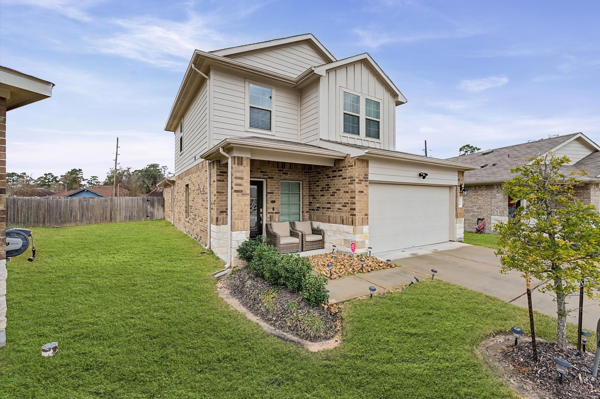 22803 Berthoud Trail Spring, TX 77373 - Photo 2 of 42 a front view of a house with a yard and garage