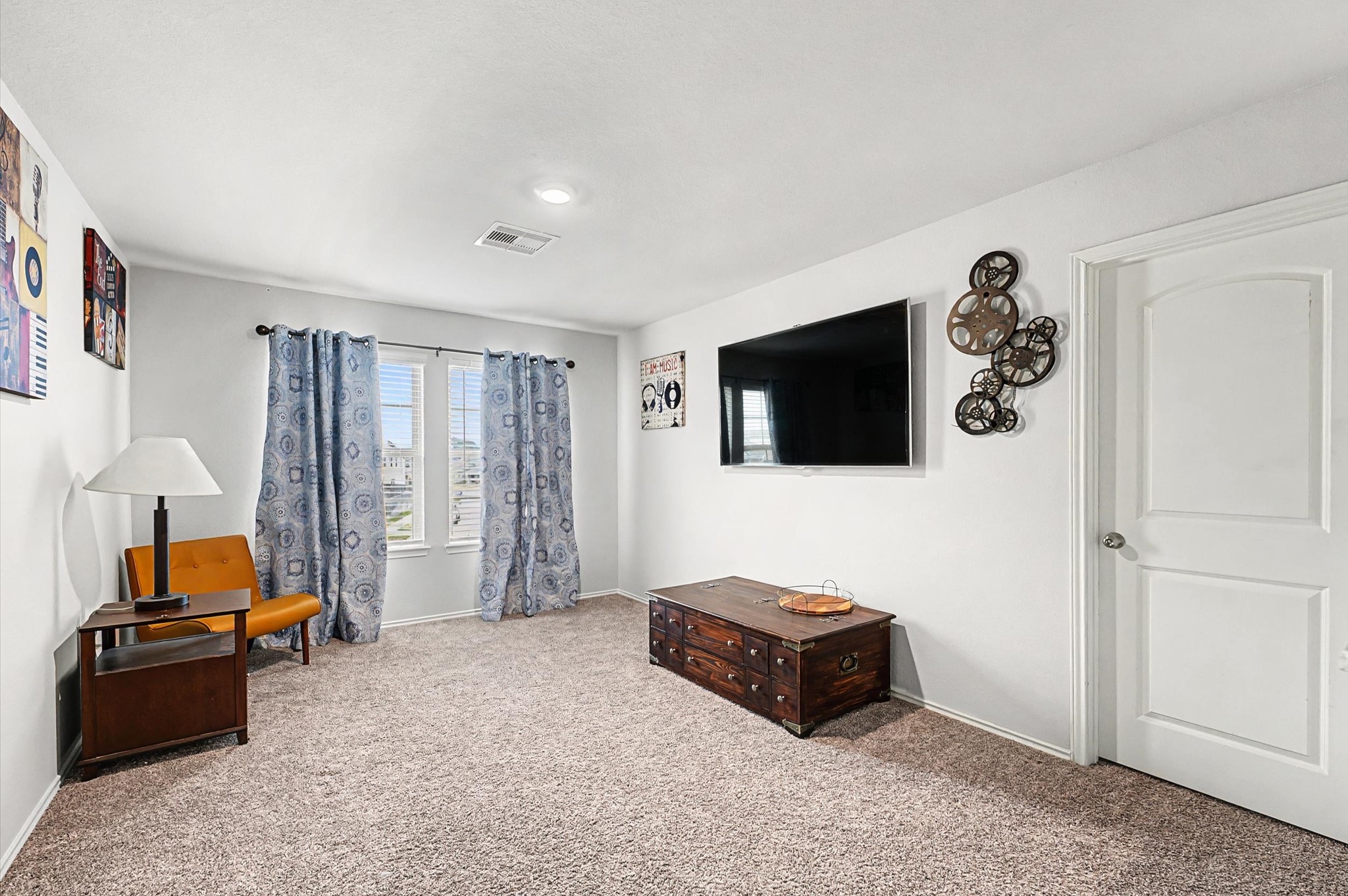 22803 Berthoud Trail Spring, TX 77373 - Photo 21 of 42 a living room with furniture and a flat screen tv