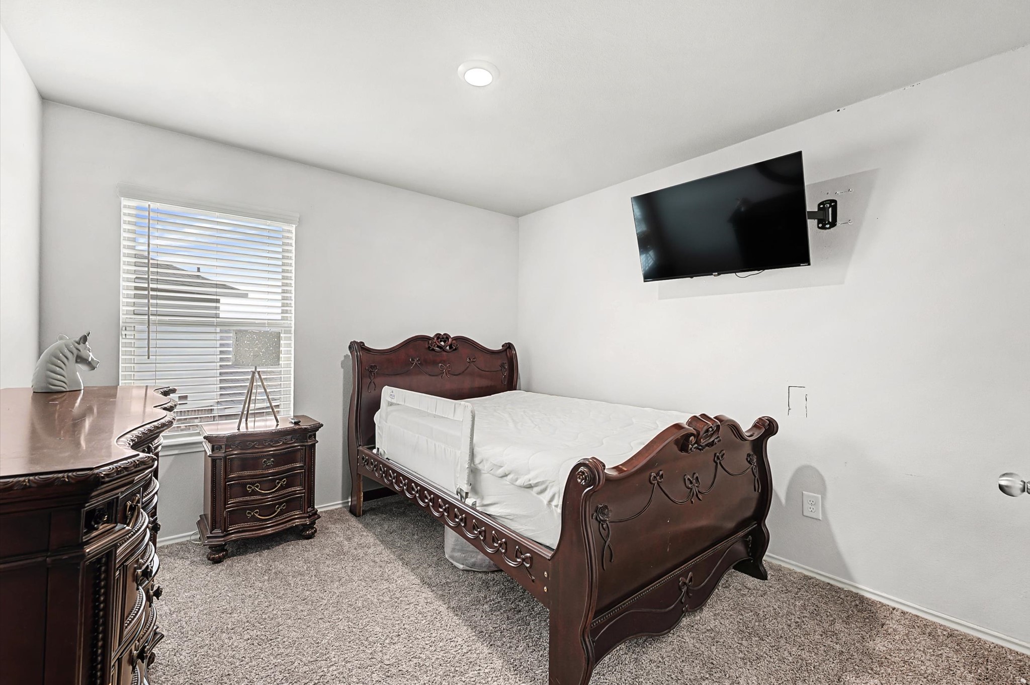 22803 Berthoud Trail Spring, TX 77373 - Photo 23 of 42 a bedroom with a bed and a television
