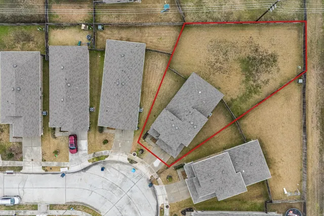 an aerial view of a highlighted house