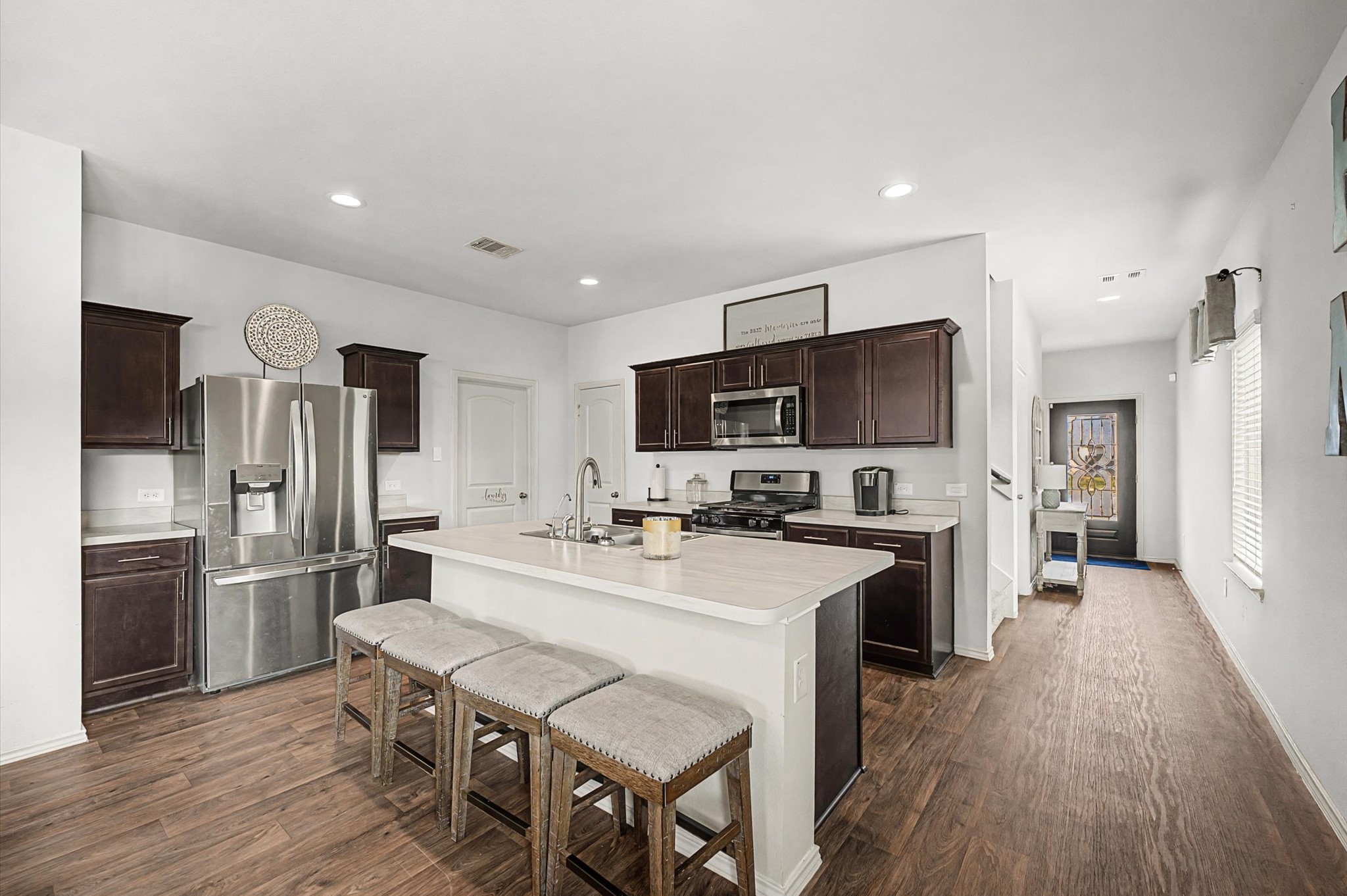 22803 Berthoud Trail Spring, TX 77373 - Photo 6 of 42 a large kitchen with a table and refrigerator