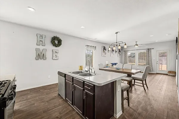 a kitchen with a table and chairs in it