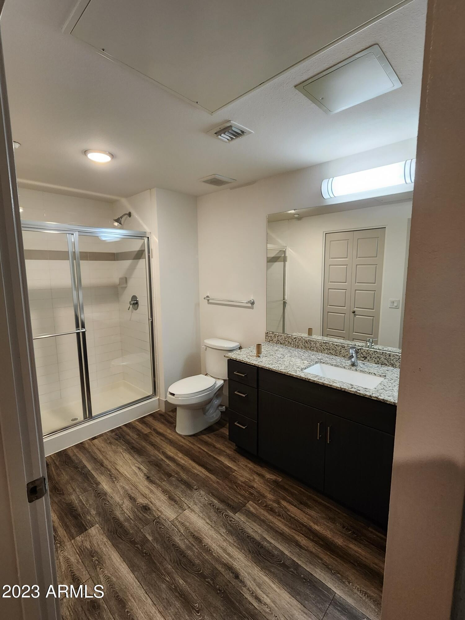 250 East Ray Road, Unit A3 Chandler, AZ 85225 - Photo 5 of 11 a spacious bathroom with a double vanity sink toilet and shower