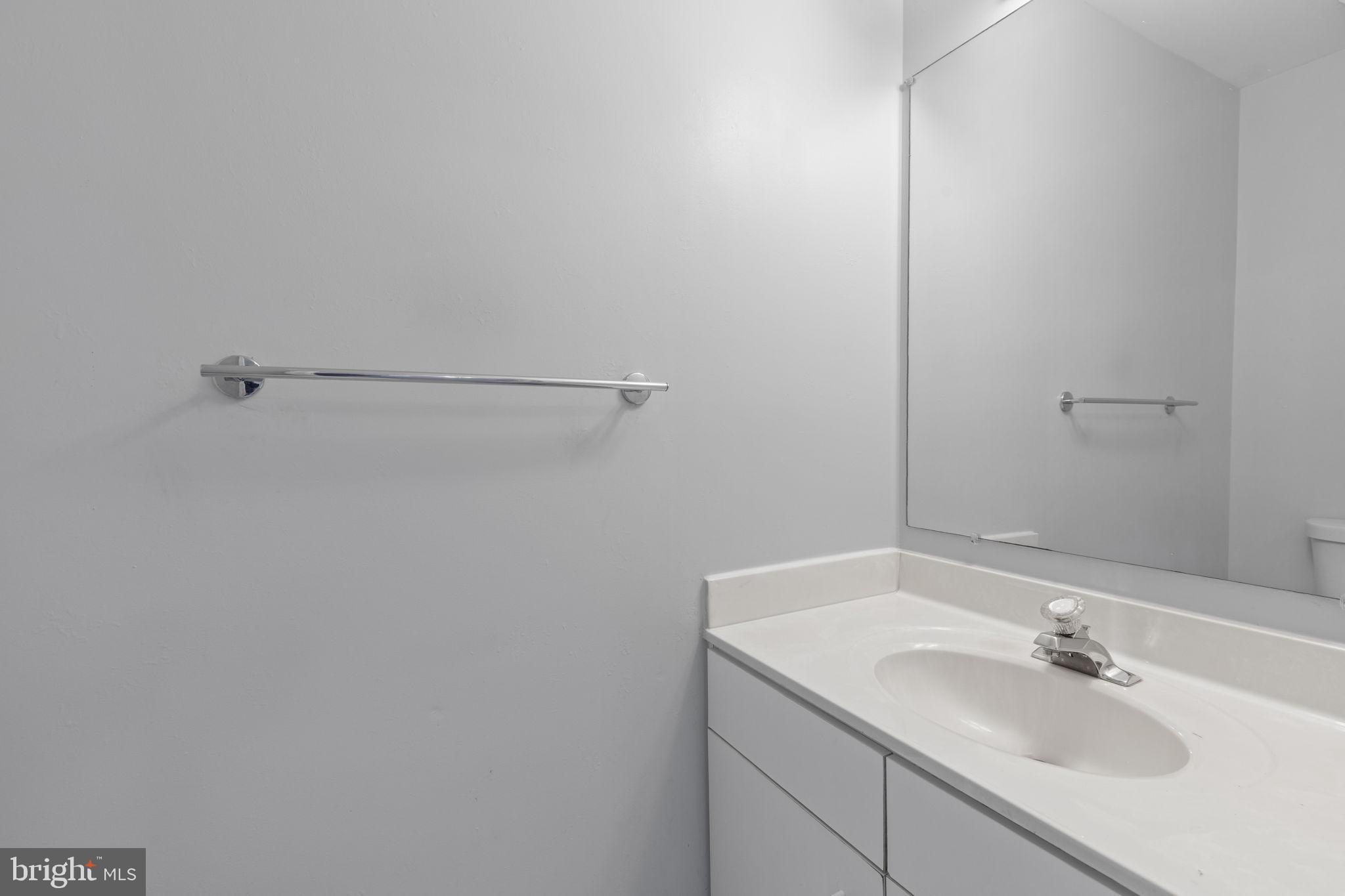 126 Gentlebrook Road Owings Mills, MD 21117 - Photo 13 of 30 a bathroom with a sink and a mirror