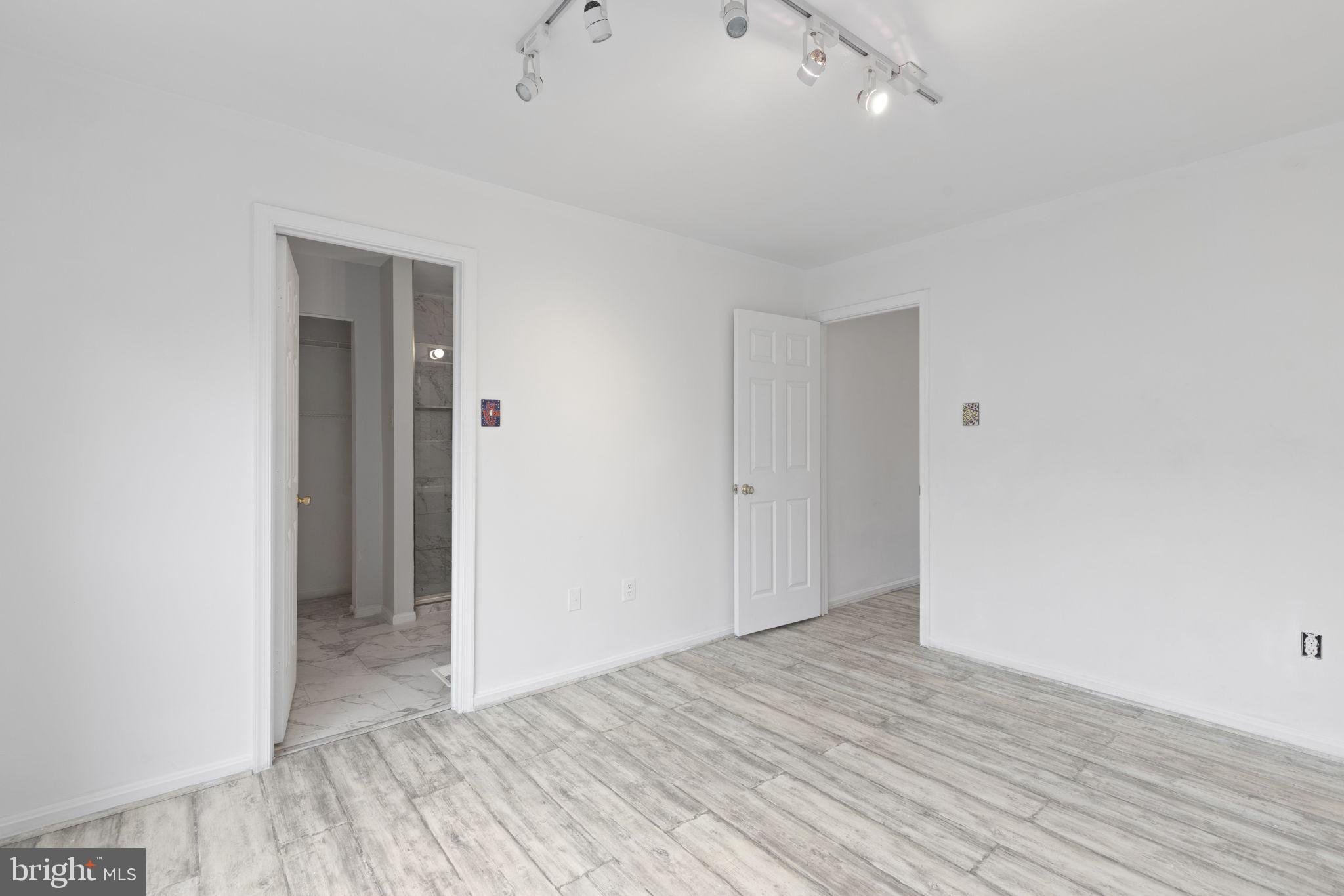 126 Gentlebrook Road Owings Mills, MD 21117 - Photo 14 of 30 a view of an empty room with wooden floor