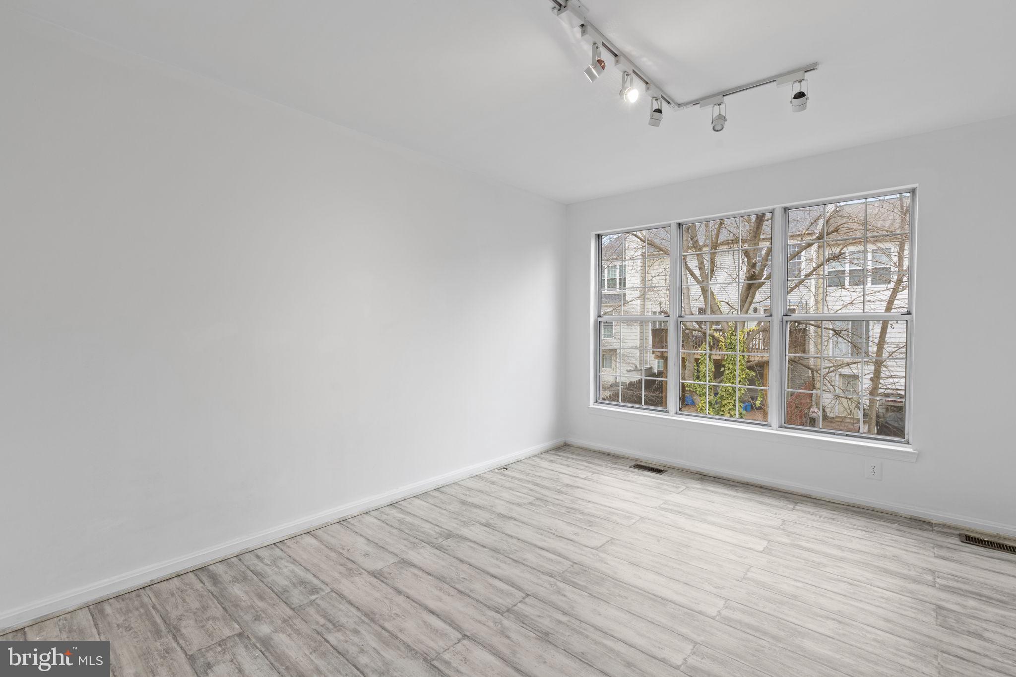 126 Gentlebrook Road Owings Mills, MD 21117 - Photo 15 of 30 wooden floor in an empty room with a window
