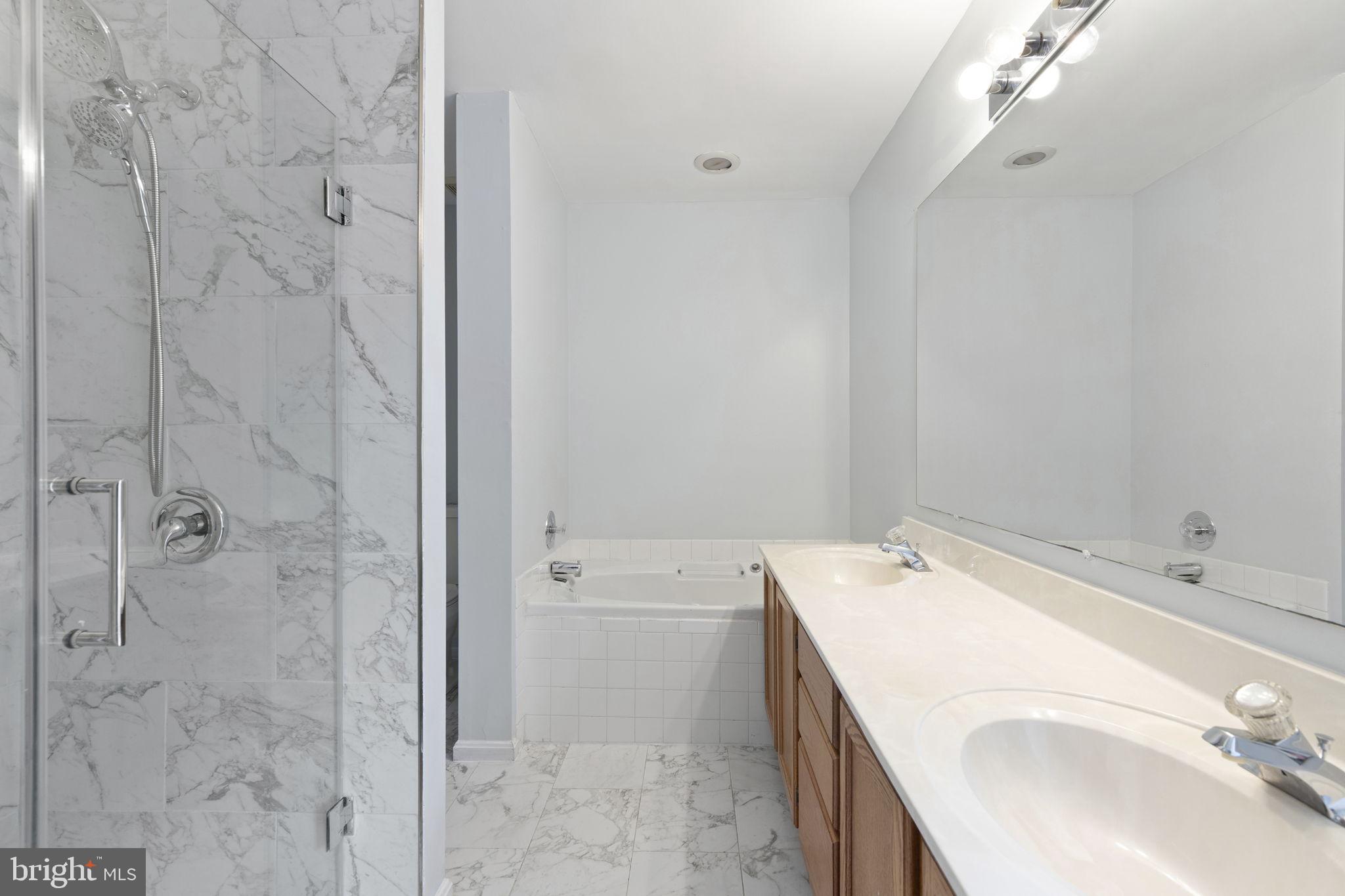 126 Gentlebrook Road Owings Mills, MD 21117 - Photo 16 of 30 a bathroom with a sink a toilet and shower