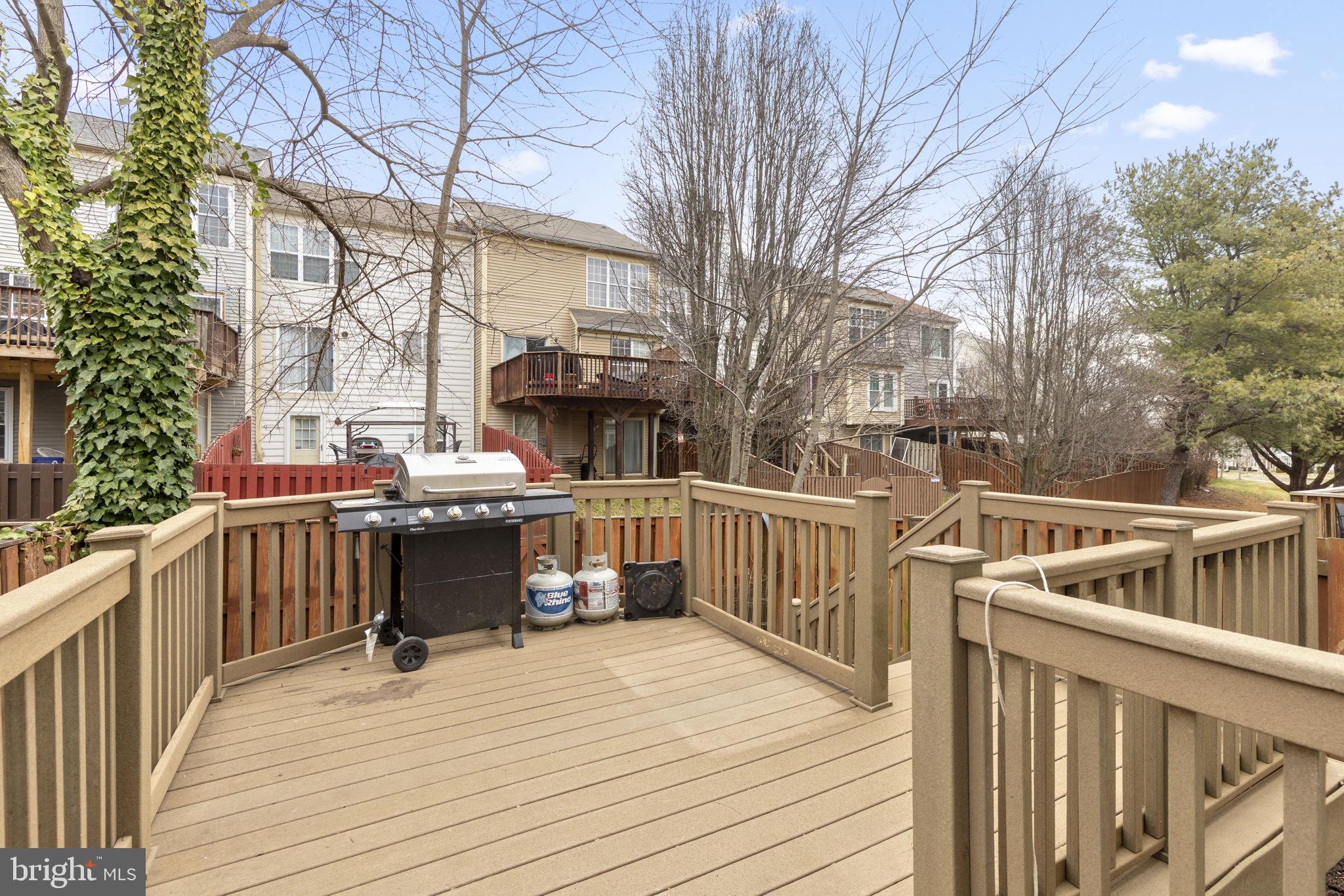 126 Gentlebrook Road Owings Mills, MD 21117 - Photo 26 of 30 a view of a deck with chairs and wooden fence