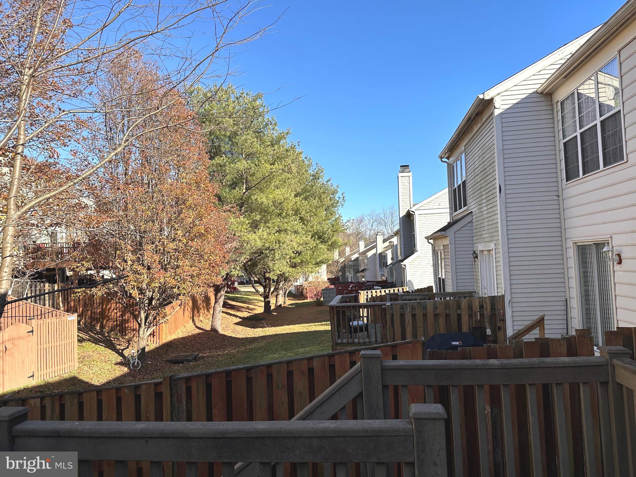 126 Gentlebrook Road Owings Mills, MD 21117 - Photo 28 of 30 a view of a street with wooden fence and trees
