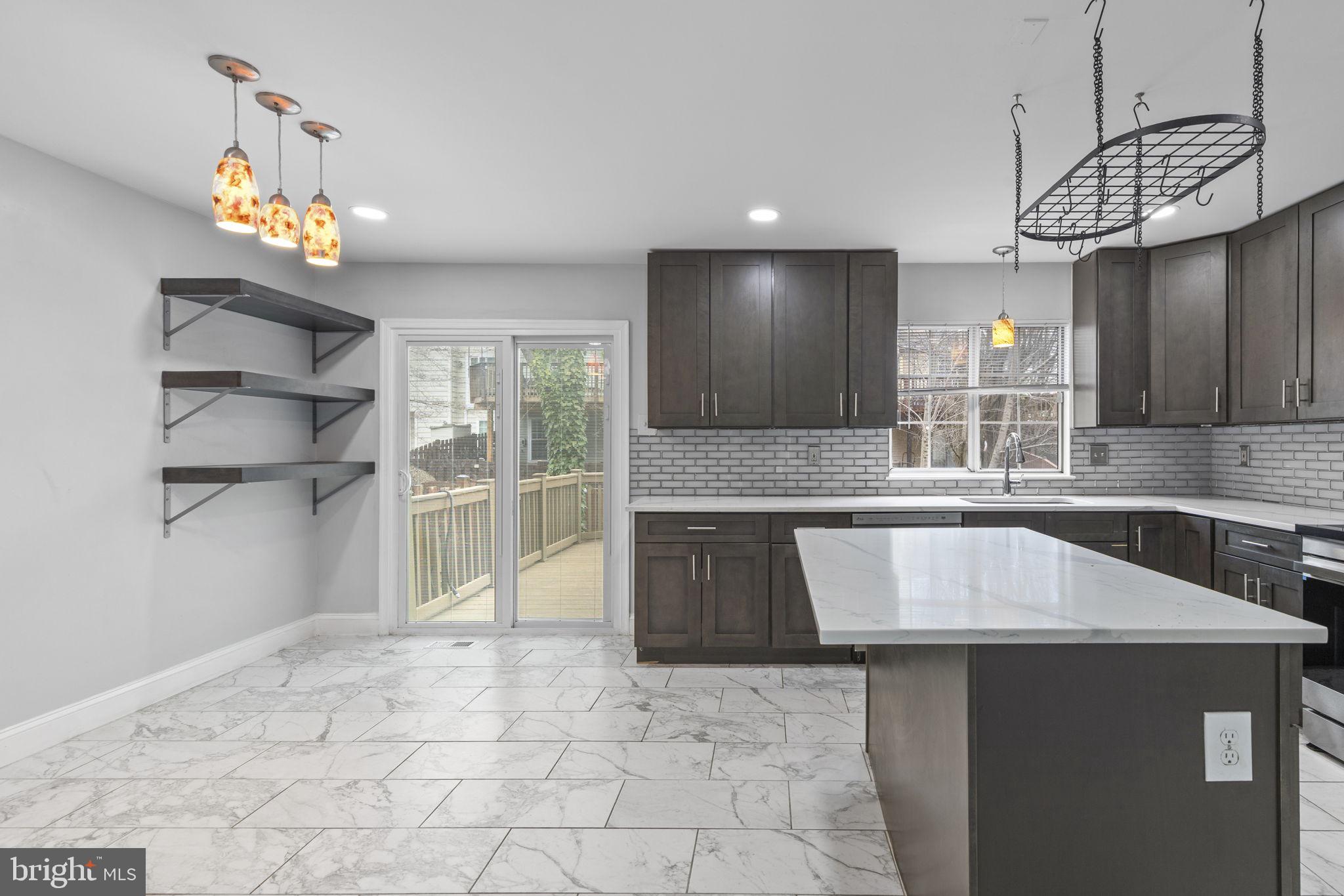 126 Gentlebrook Road Owings Mills, MD 21117 - Photo 6 of 30 a kitchen with granite countertop a stove a sink a refrigerator and a stove