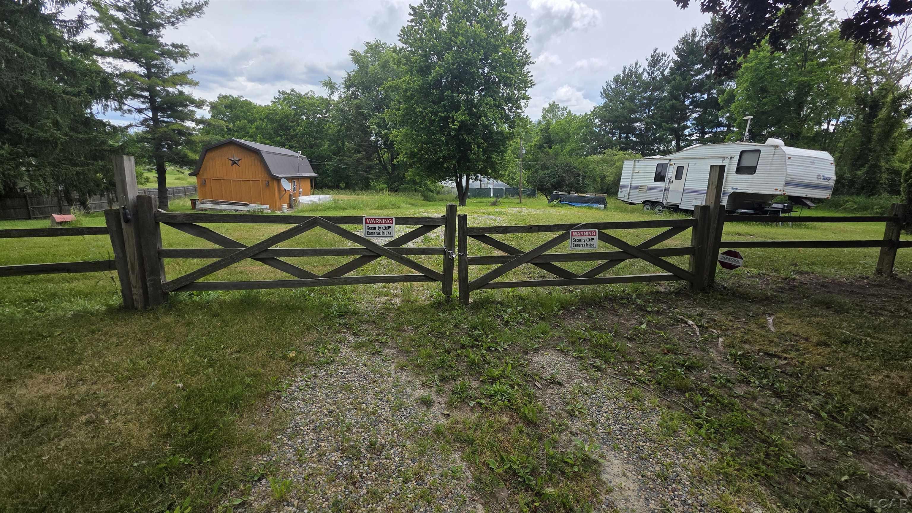 6591 South Tripp Road Osseo, MI 49266 - Photo 1 of 8