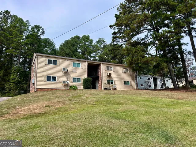a big house with large trees and a big yard