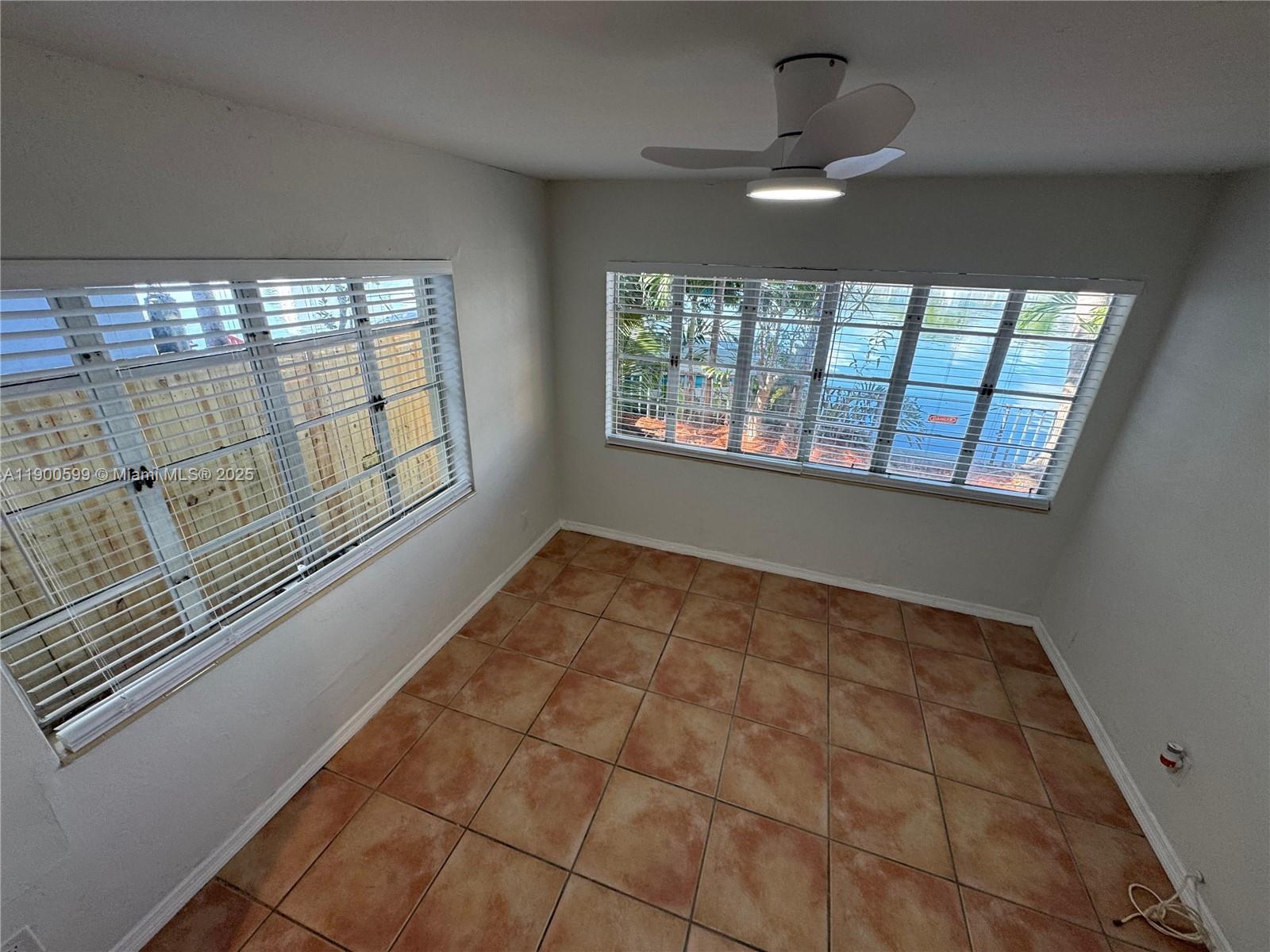 8300 Byron Avenue, Unit 5 Miami Beach, FL 33141 - Photo 6 of 12 a view of an empty room and window