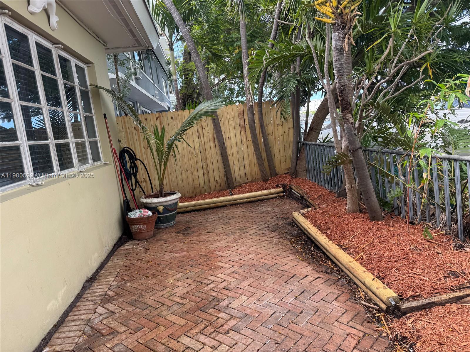 8300 Byron Avenue, Unit 5 Miami Beach, FL 33141 - Photo 10 of 12 a view of an outdoor space in a backyard