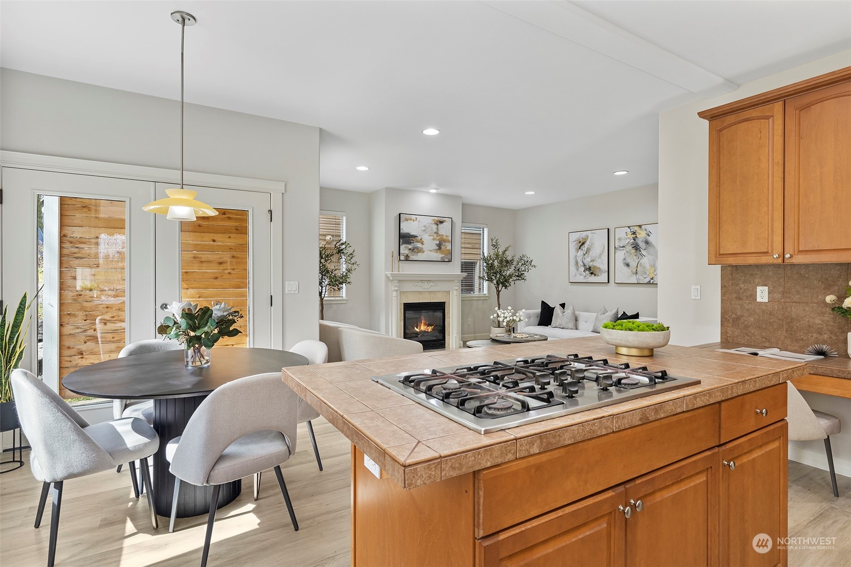 202 199th Street Southwest Bothell, WA 98012 - Photo 12 of 30 a kitchen with a stove a table and chairs in it