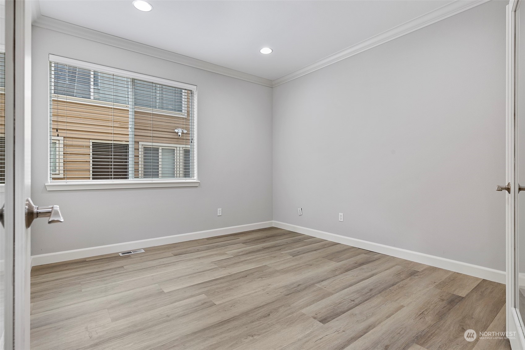 202 199th Street Southwest Bothell, WA 98012 - Photo 16 of 30 a view of a room with wooden floor and windows