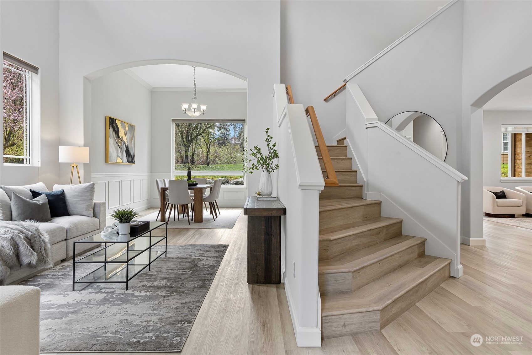 202 199th Street Southwest Bothell, WA 98012 - Photo 2 of 30 a living room with furniture and a chandelier