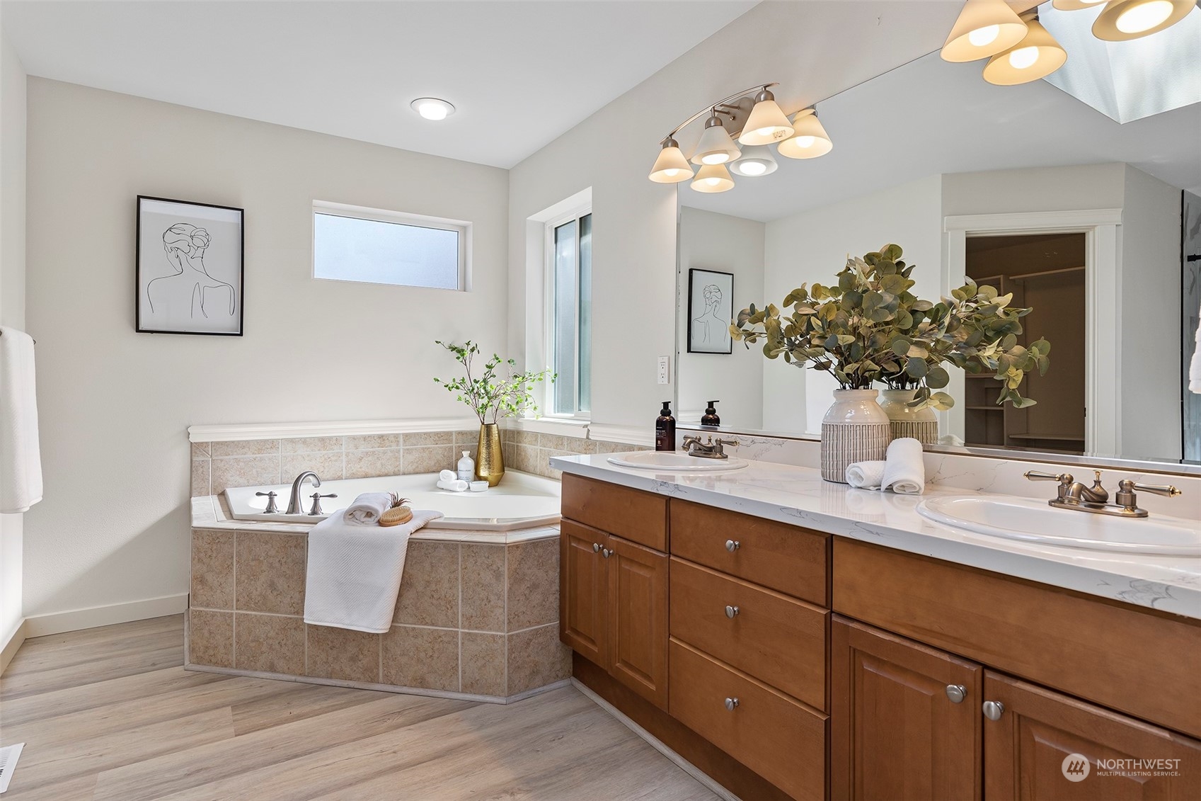 202 199th Street Southwest Bothell, WA 98012 - Photo 23 of 30 a bathroom with a sink mirror and vanity