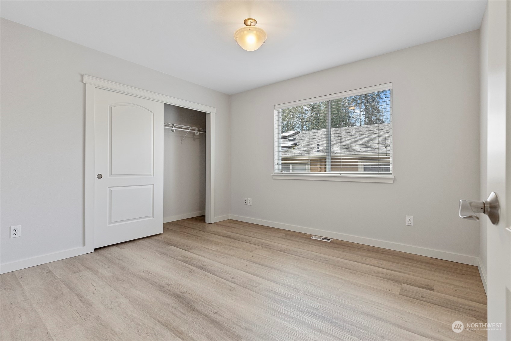 202 199th Street Southwest Bothell, WA 98012 - Photo 25 of 30 an empty room with wooden floor and windows