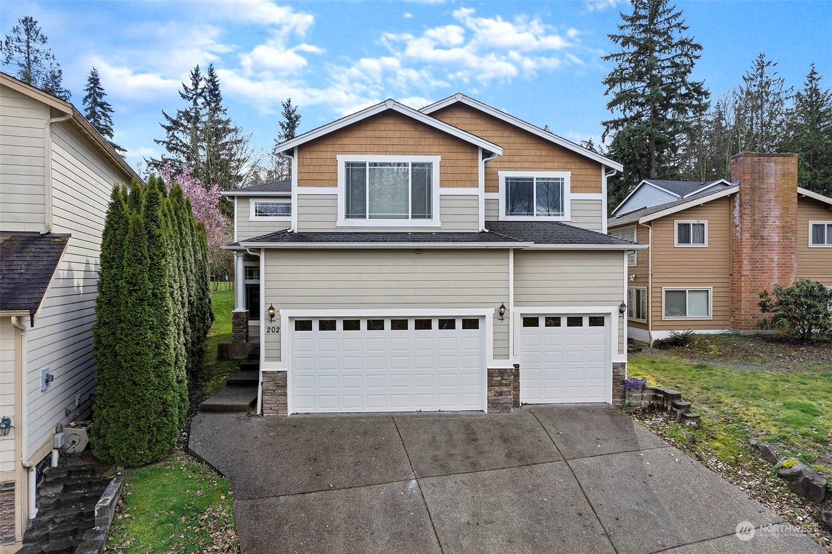 202 199th Street Southwest Bothell, WA 98012 - Photo 30 of 30 a front view of a house with garden