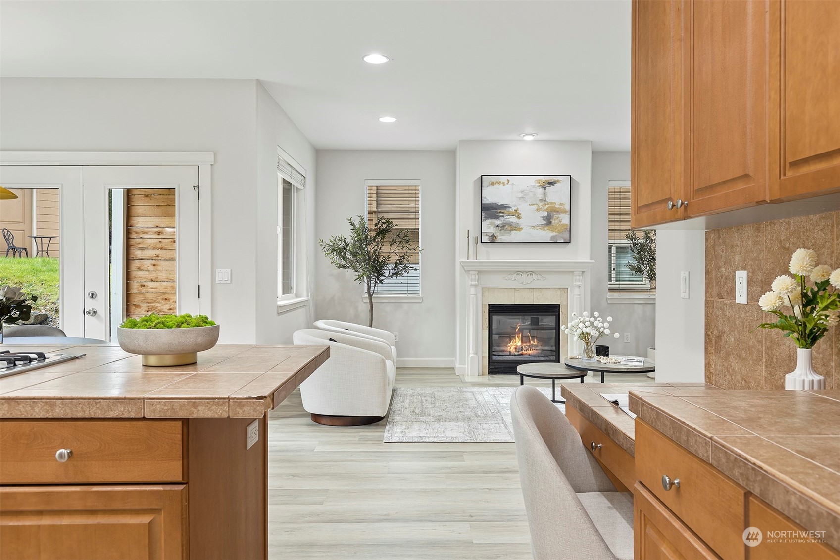 202 199th Street Southwest Bothell, WA 98012 - Photo 10 of 30 a living room with furniture a fireplace and a potted plant