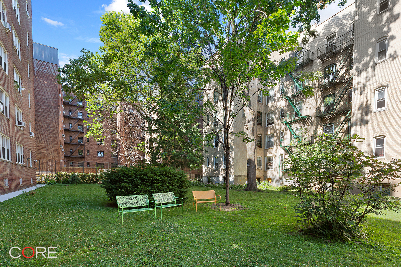 35-21 79th Street, Unit 1L Queens, NY 11372 - Photo 6 of 8 a garden with trees in front of it