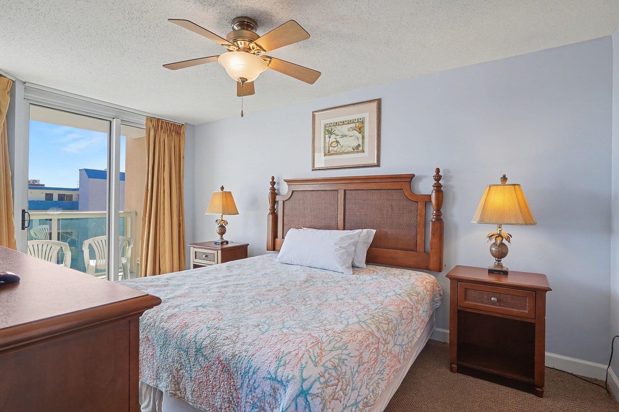 1707 Perrin Drive, Unit 701 North Myrtle Beach, SC 29582 - Photo 14 of 40 Bedroom with carpet, access to outside, a textured ceiling, and ceiling fan