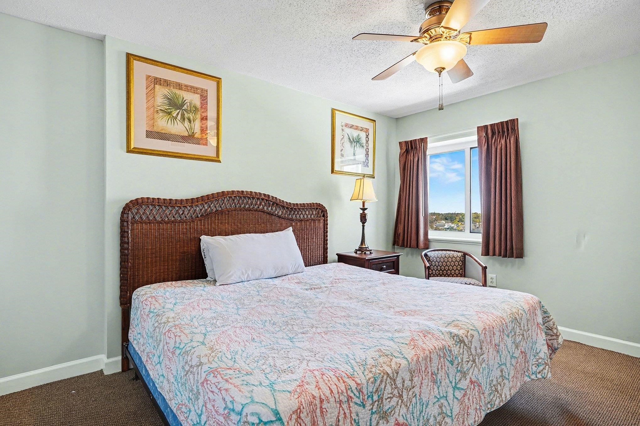 1707 Perrin Drive, Unit 701 North Myrtle Beach, SC 29582 - Photo 22 of 40 Bedroom featuring carpet flooring, a ceiling fan, and a textured ceiling