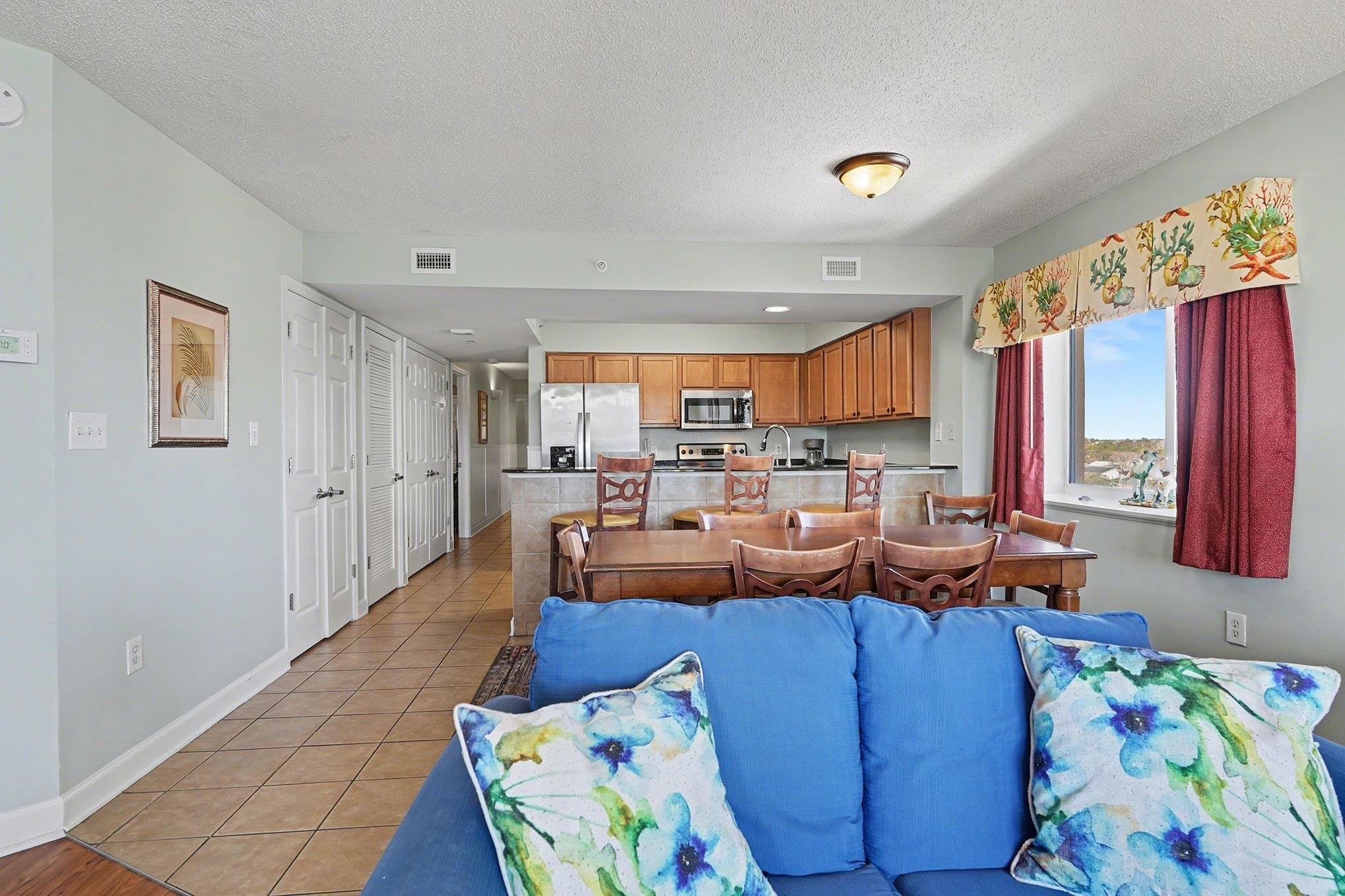 1707 Perrin Drive, Unit 701 North Myrtle Beach, SC 29582 - Photo 7 of 40 Living area featuring light tile patterned flooring and a textured ceiling