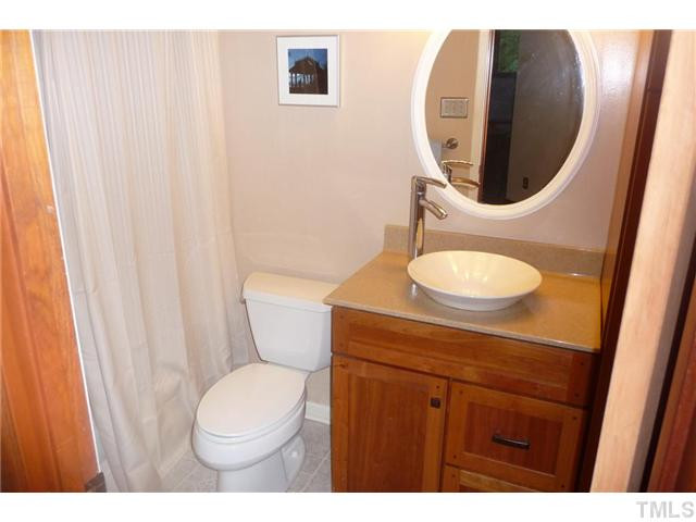 2522 Laine Road Chapel Hill, NC 27516 - Photo 12 of 22 a bathroom with a toilet a sink and a mirror