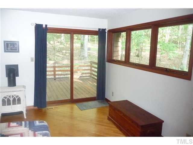 2522 Laine Road Chapel Hill, NC 27516 - Photo 17 of 22 a view of an empty room with wooden floor and a window