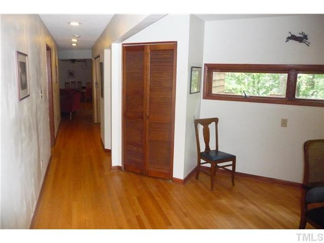 2522 Laine Road Chapel Hill, NC 27516 - Photo 18 of 22 a view of a hallway with wooden floor and windows