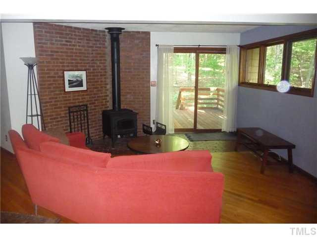 2522 Laine Road Chapel Hill, NC 27516 - Photo 21 of 22 a bedroom with a bed and wooden floor