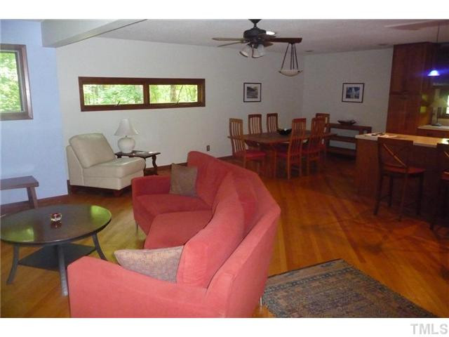 2522 Laine Road Chapel Hill, NC 27516 - Photo 22 of 22 a living room with furniture and wooden floor