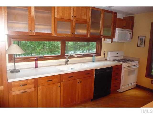 2522 Laine Road Chapel Hill, NC 27516 - Photo 5 of 22 a kitchen with stainless steel appliances granite countertop a sink stove and cabinets