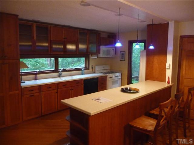 2522 Laine Road Chapel Hill, NC 27516 - Photo 6 of 22 a kitchen with a sink a counter top space and appliances