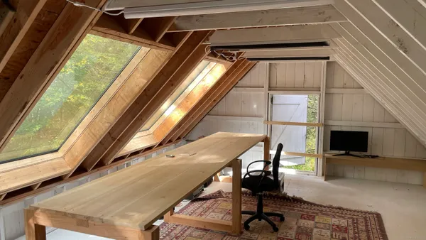a view of balcony with wooden floor and furniture