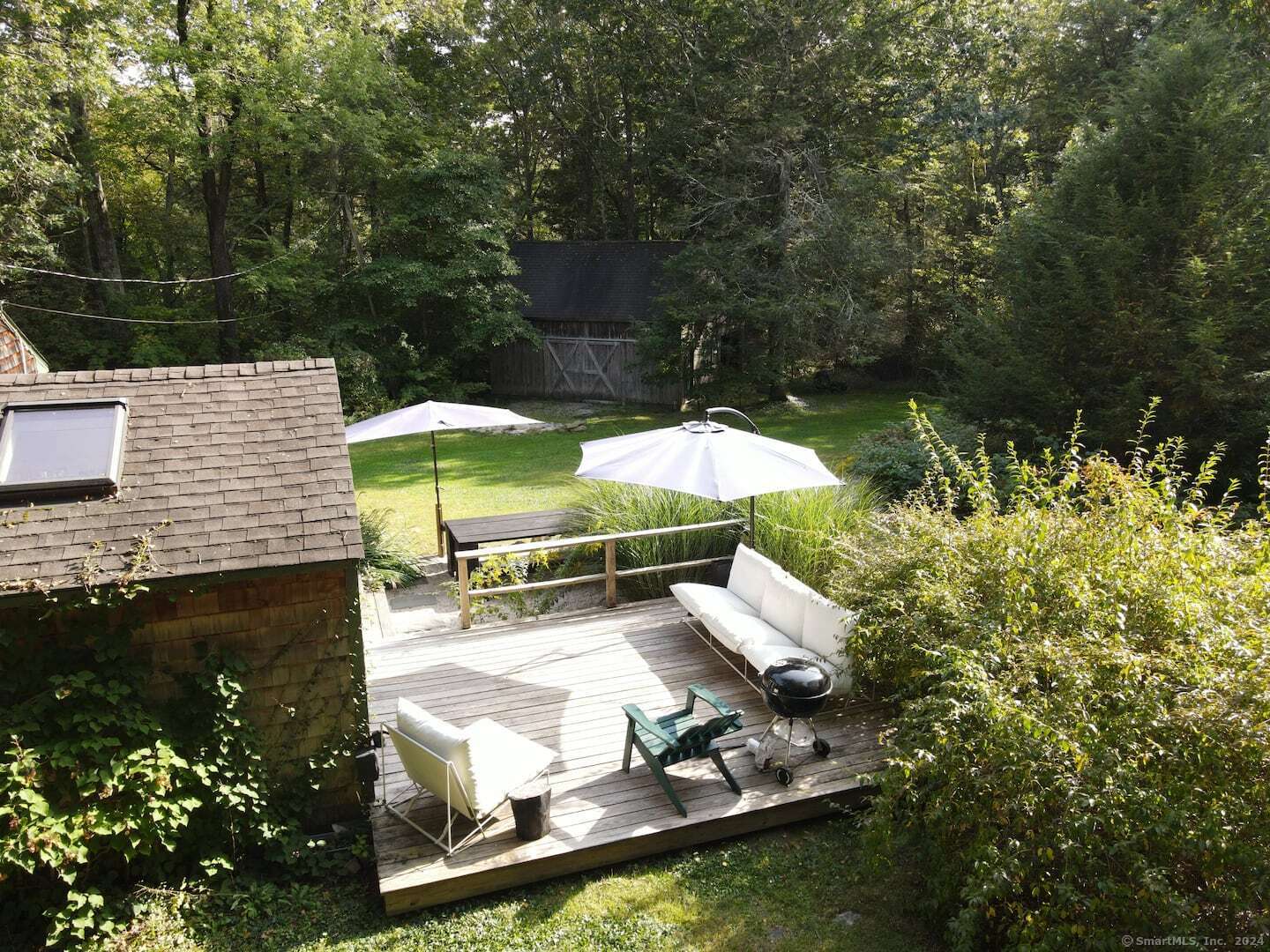 433 Segar Mountain Road Kent, CT 06785 - Photo 5 of 15 a view of a backyard with plants and patio