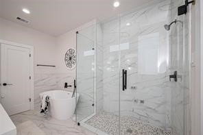 3544 Mt Pleasant Street Houston, TX 77021 - Photo 11 of 12 a bathroom with a bathtub and a shower