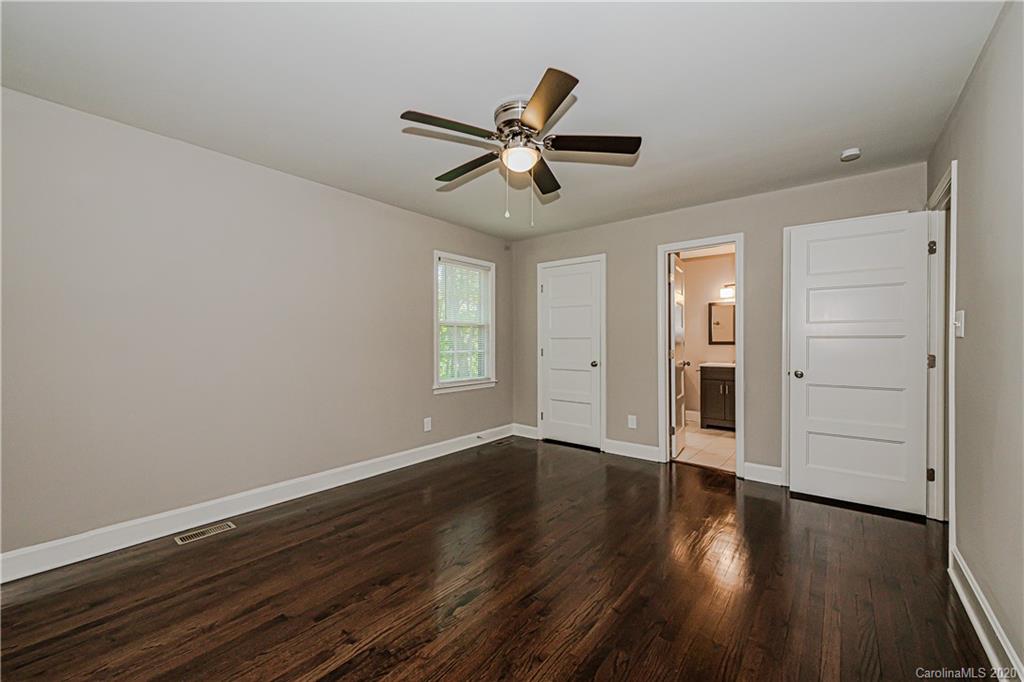 7415 Watercrest Road Charlotte, NC 28210 - Photo 14 of 35 wooden floor in an empty room with a window